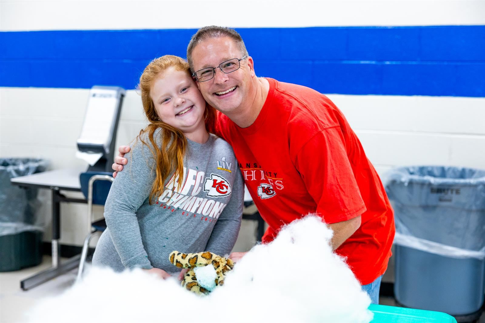dad and daughter smiling